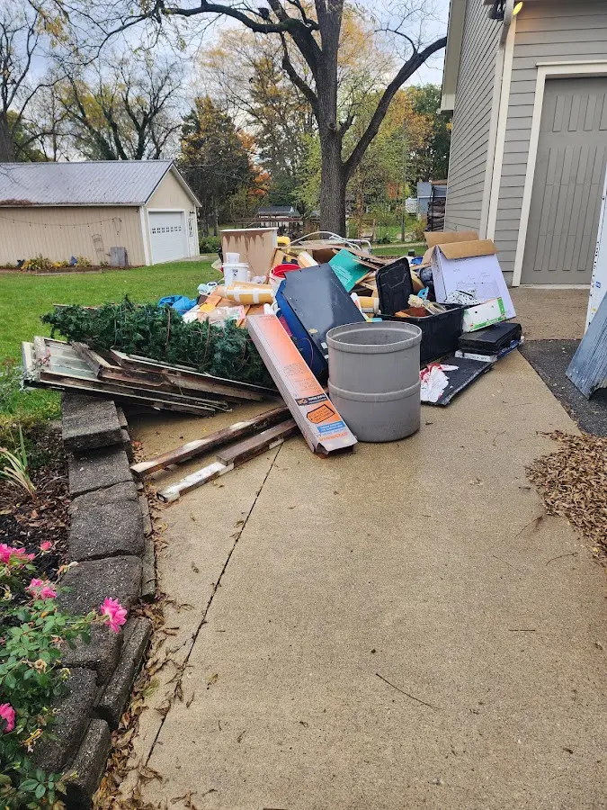 Dumpster being loaded with debris for 3 Yard Dumpster Rental in Pulaski